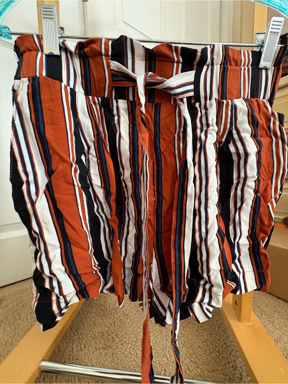 Striped lightweight elastic Waist Tie Shorts orange, black & white with pockets.